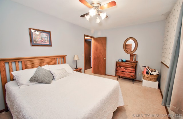 bedroom with light carpet and a ceiling fan