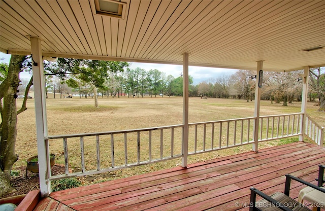 deck featuring a lawn