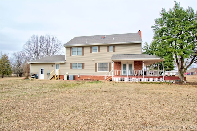 rear view of property with covered porch, a lawn, a chimney, and cooling unit