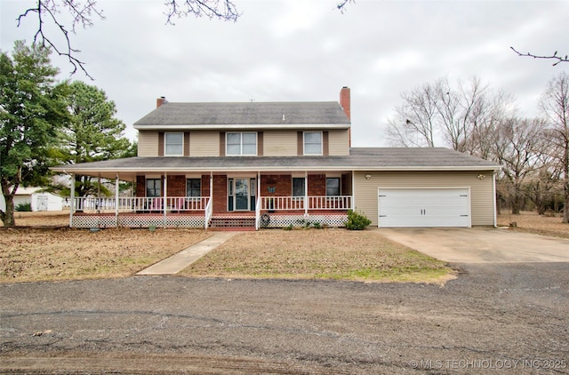 farmhouse inspired home with covered porch, an attached garage, a chimney, and concrete driveway