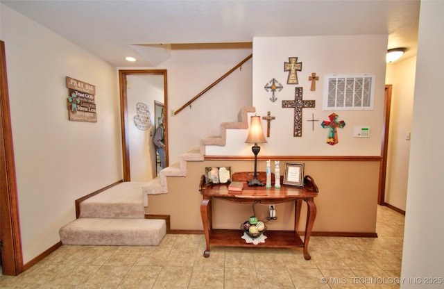 staircase with recessed lighting, visible vents, and baseboards