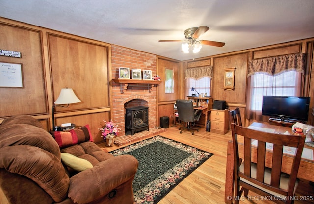 living area featuring ceiling fan and wood finished floors