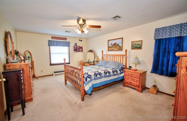 bedroom featuring a baseboard radiator, light colored carpet, visible vents, a ceiling fan, and baseboards