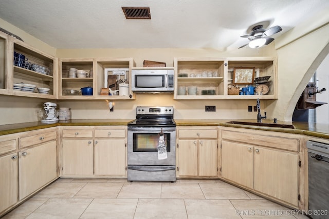 448 Springview Dr, Skiatook, OK 74070 - kitchen featuring stainless steel appliances, open shelves, a sink, light brown cabinetry, and light tile patterned floors