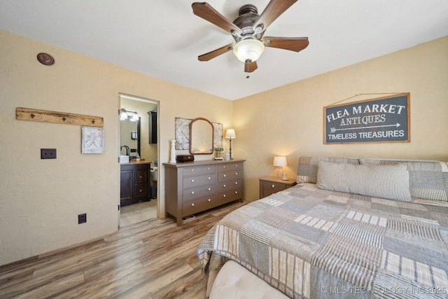448 Springview Dr, Skiatook, OK 74070 - bedroom featuring light wood finished floors, connected bathroom, and a ceiling fan