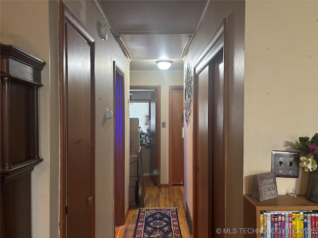 hallway with wood finished floors