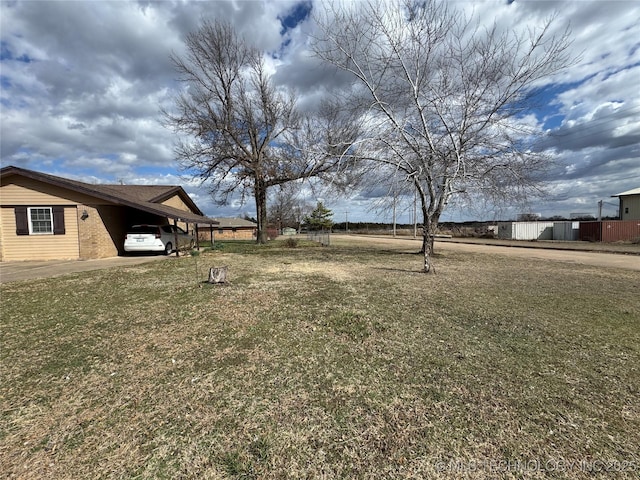 view of yard featuring an attached carport