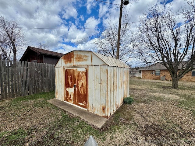 view of shed with fence