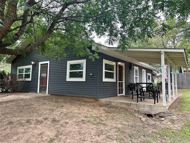 exterior space with a patio and fence