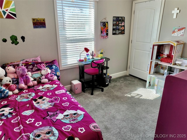 carpeted bedroom with baseboards