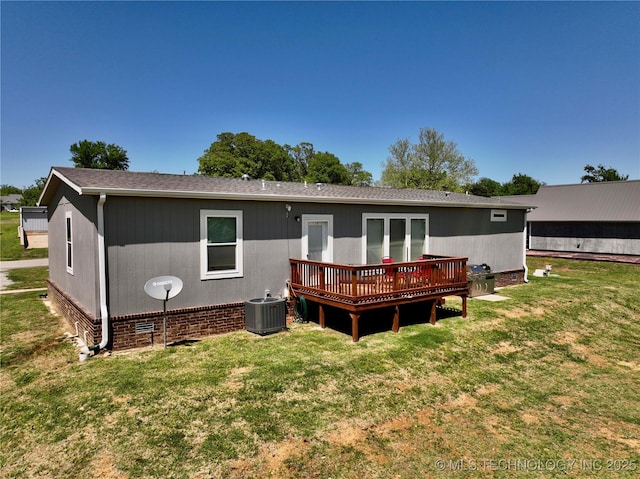 back of house featuring crawl space, a yard, a deck, and central air condition unit