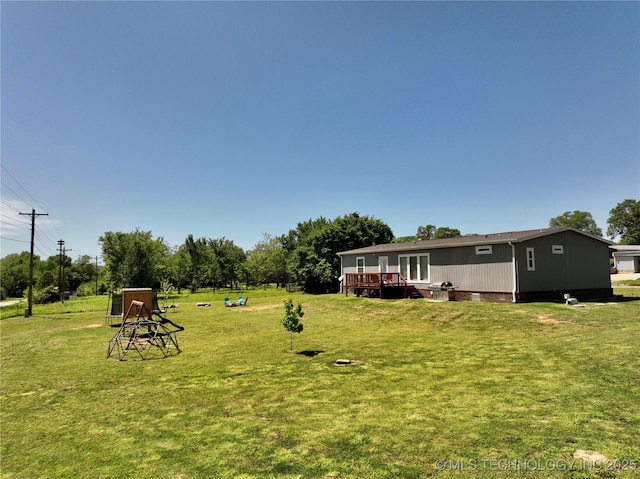 view of yard featuring a wooden deck