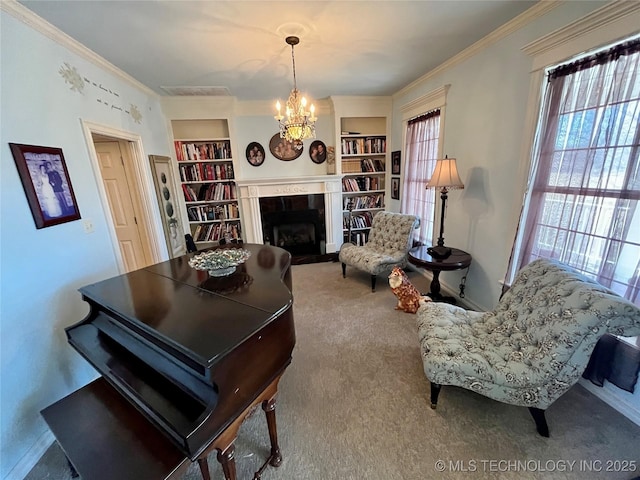 living room with a chandelier, built in shelves, carpet floors, a fireplace, and crown molding