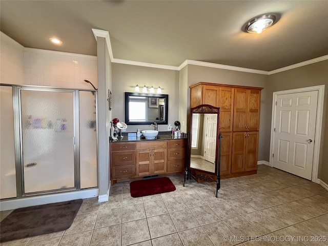 bathroom featuring ornamental molding, tile patterned flooring, and a shower stall