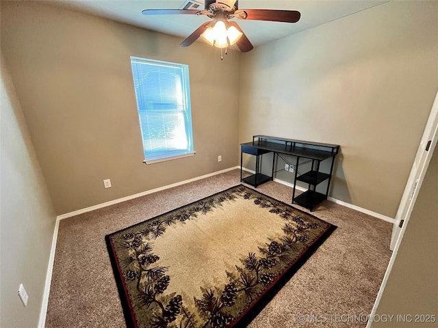 carpeted bedroom with ceiling fan and baseboards