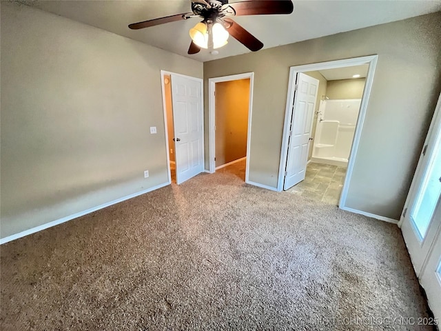 unfurnished bedroom featuring a ceiling fan, carpet, connected bathroom, and baseboards