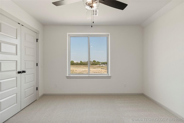 2719 E 135th Dr S, Bixby, OK 74008 - unfurnished bedroom featuring visible vents, carpet flooring, baseboards, and a ceiling fan
