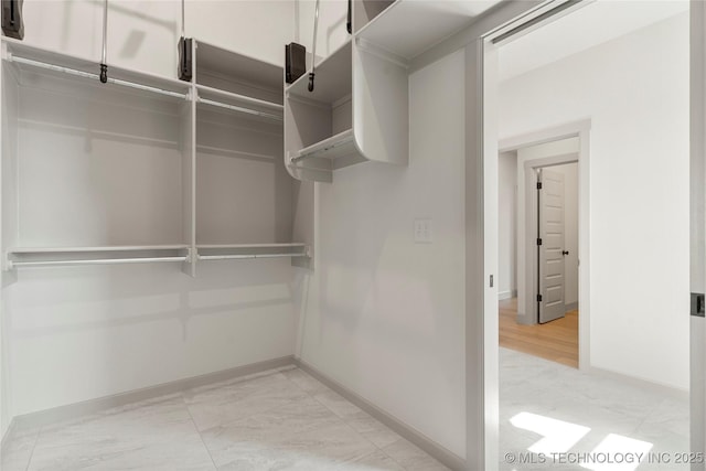 2719 E 135th Dr S, Bixby, OK 74008 - walk in closet featuring marble finish floor