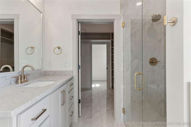 2719 E 135th Dr S, Bixby, OK 74008 - bathroom featuring vanity, marble finish floor, and a shower stall