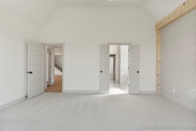 2719 E 135th Dr S, Bixby, OK 74008 - unfurnished bedroom featuring baseboards, carpet floors, and high vaulted ceiling