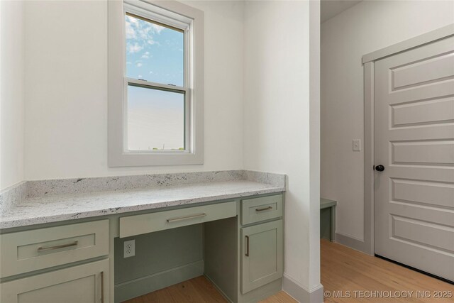 2719 E 135th Dr S, Bixby, OK 74008 - unfurnished office featuring built in desk and light wood-style floors