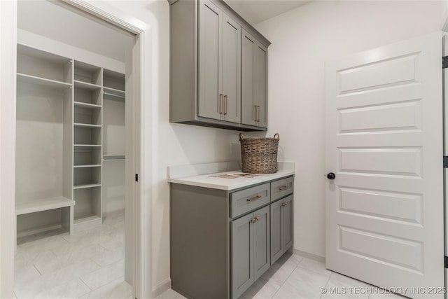 washroom featuring baseboards