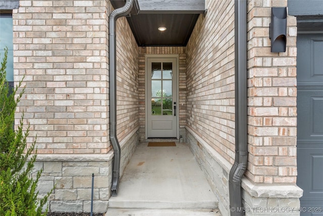 property entrance with brick siding