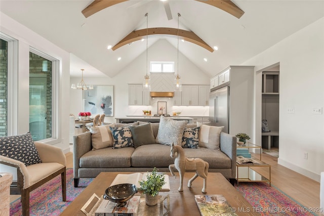 living room featuring light wood-type flooring, recessed lighting, high vaulted ceiling, and beamed ceiling