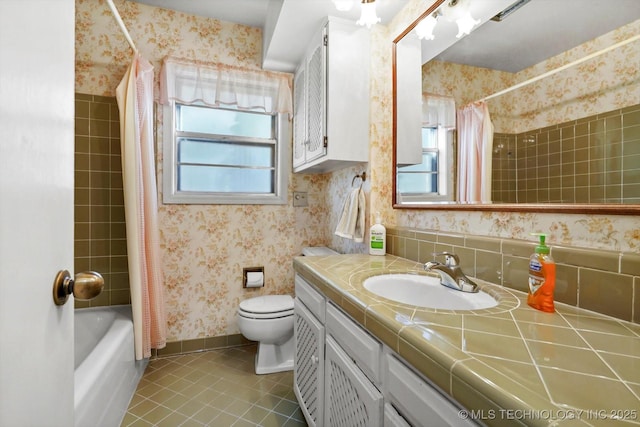 bathroom with wallpapered walls, baseboards, toilet, tile patterned floors, and vanity