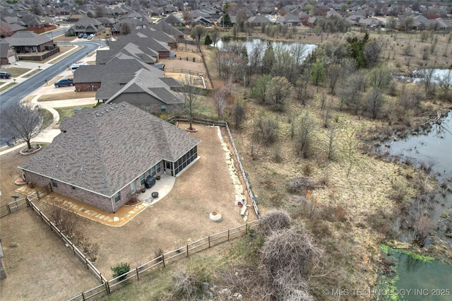 bird's eye view with a water view and a residential view