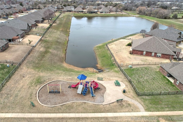 birds eye view of property featuring a residential view and a water view