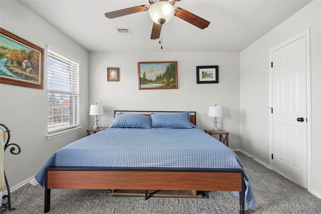 bedroom featuring visible vents, ceiling fan, baseboards, and carpet floors