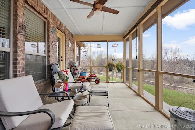 sunroom featuring ceiling fan