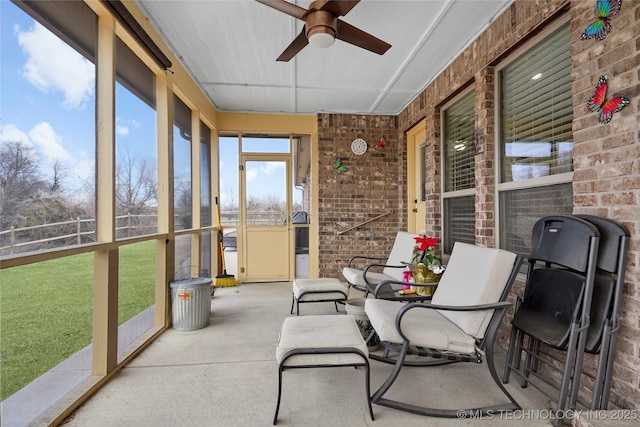 sunroom featuring ceiling fan