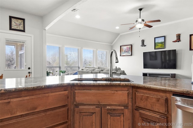 kitchen with a sink, stone countertops, stainless steel dishwasher, open floor plan, and brown cabinetry