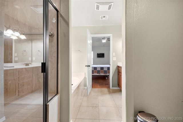 bathroom with vanity, visible vents, and tile patterned flooring