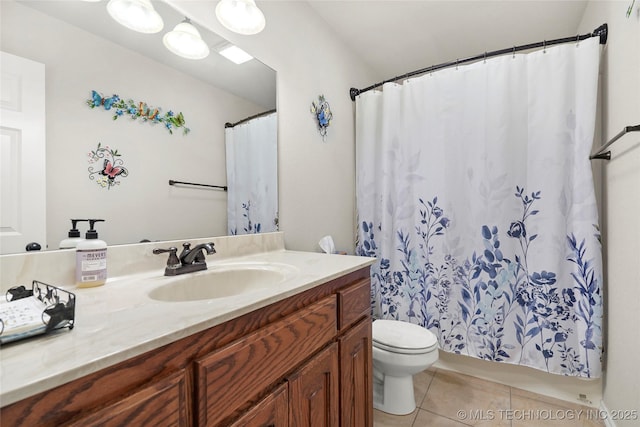 bathroom with tile patterned floors, toilet, and vanity