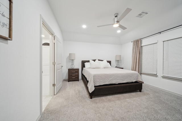 bedroom with recessed lighting, visible vents, ceiling fan, and light carpet