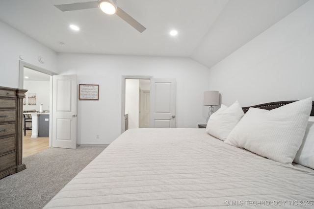 carpeted bedroom with recessed lighting, vaulted ceiling, and ceiling fan