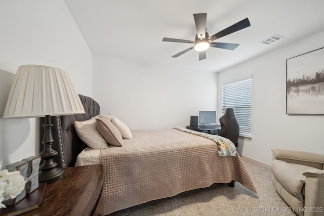 carpeted bedroom featuring visible vents and a ceiling fan