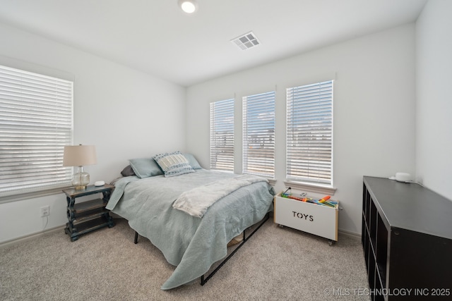 carpeted bedroom with visible vents