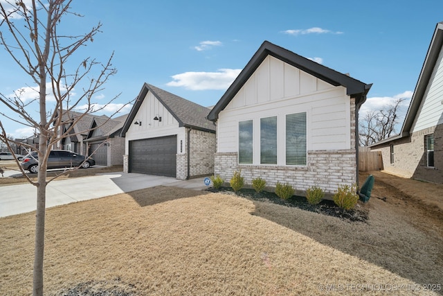 view of front of home with an attached garage, board and batten siding, and concrete driveway