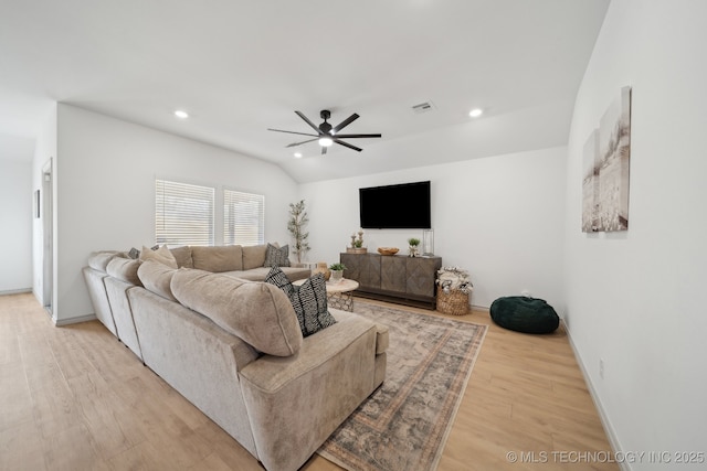 living area featuring visible vents, a ceiling fan, vaulted ceiling, light wood-style floors, and recessed lighting