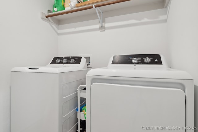 laundry area with laundry area and independent washer and dryer