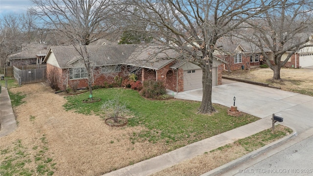 ranch-style home featuring brick siding, driveway, a front lawn, and fence