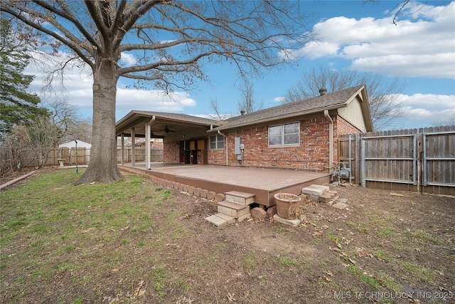 back of property with brick siding, a patio, a ceiling fan, and a fenced backyard