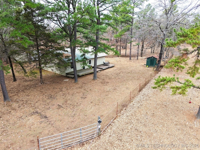 view of yard with an outbuilding and fence