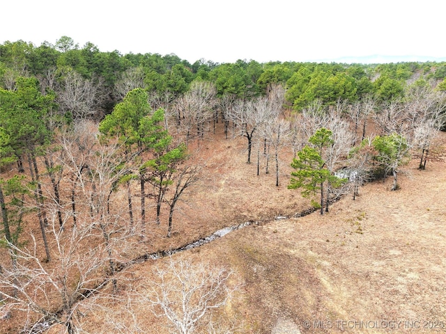 view of landscape with a forest view