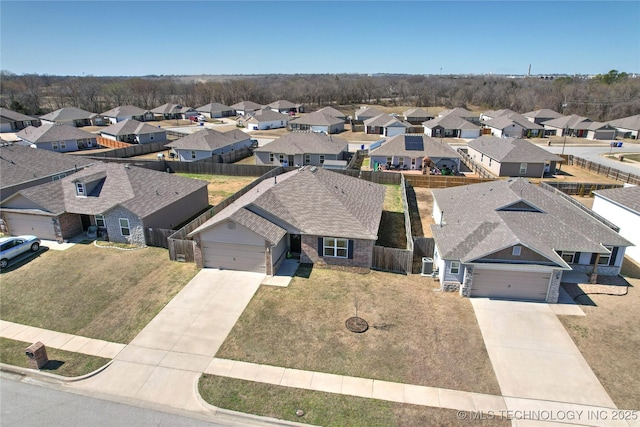 birds eye view of property with a residential view