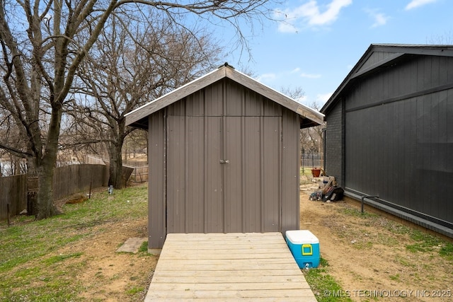 view of shed with fence